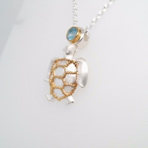 Sterling Silver And 22 Karat Gold Vermeil Sea Turtle Pendant With 1 Round Blue Topaz
