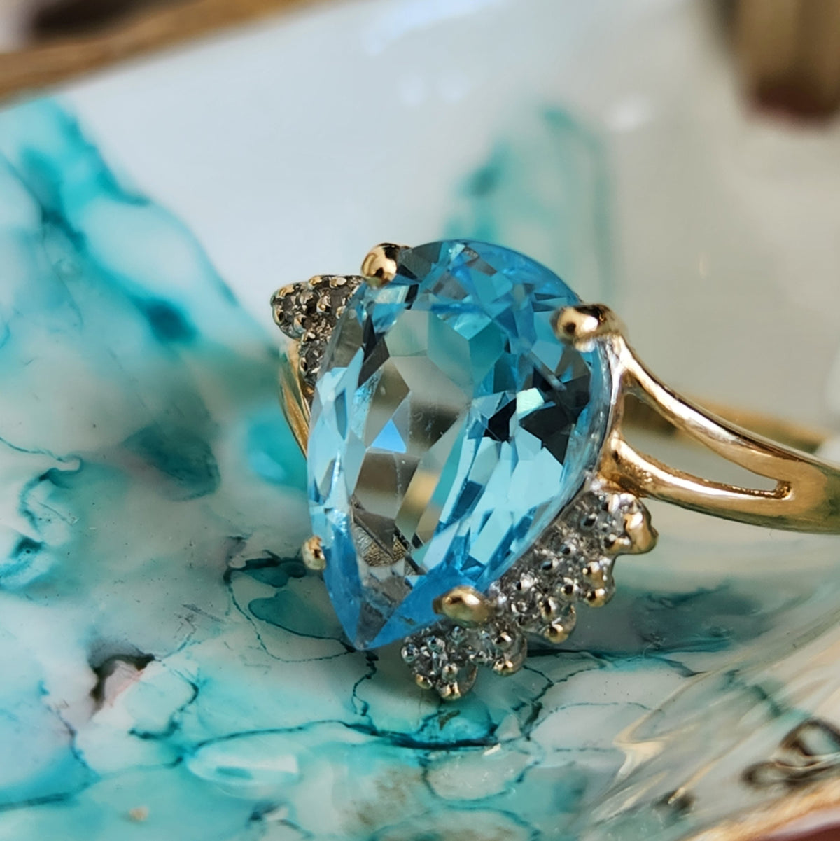 Vintage 14 Karat Yellow Gold Pear Shaped Blue Topaz Bypass Style Ring With Diamond Accents