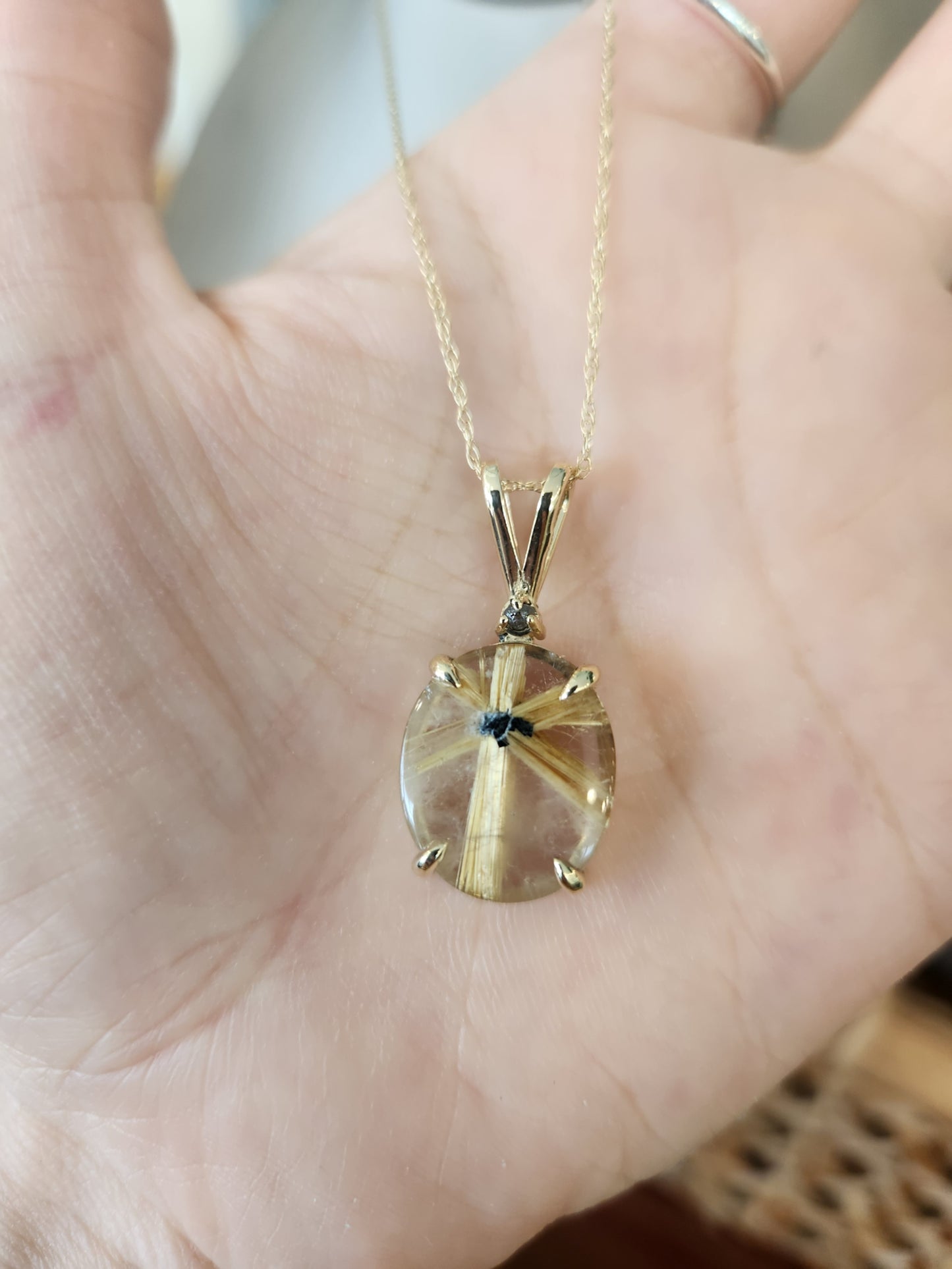 14 Karat Yellow Gold Starburst Pattern Rutilated Quartz With Rough Gray Diamond Accent