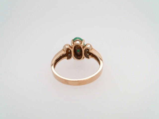 Vintage 14 Karat Yellow Gold Ring Containing An Oval Green Jade At Center Surrounded By Round Brilliant Diamonds