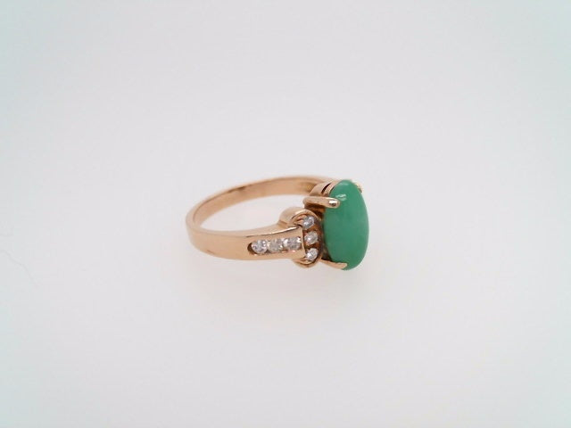 Vintage 14 Karat Yellow Gold Ring Containing An Oval Green Jade At Center Surrounded By Round Brilliant Diamonds