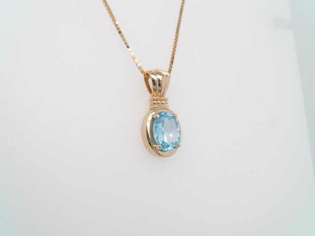 14 Karat Yellow Gold Blue Topaz Pendant With Beaded Detail