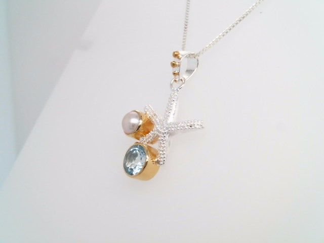Sterling Silver And 22 Karat Gold Vermeil Starfish Necklace With 1 Round Sky Blue Topaz And 1 White Freshwater Pearl 18" Chain Included