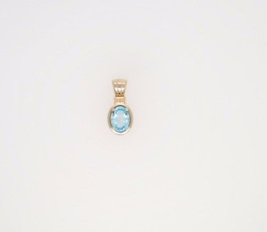 14 Karat Yellow Gold Blue Topaz Pendant With Beaded Detail