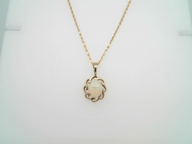 Vintage 14 Karat Yellow Gold Opal Pendant With Wave Design Frame