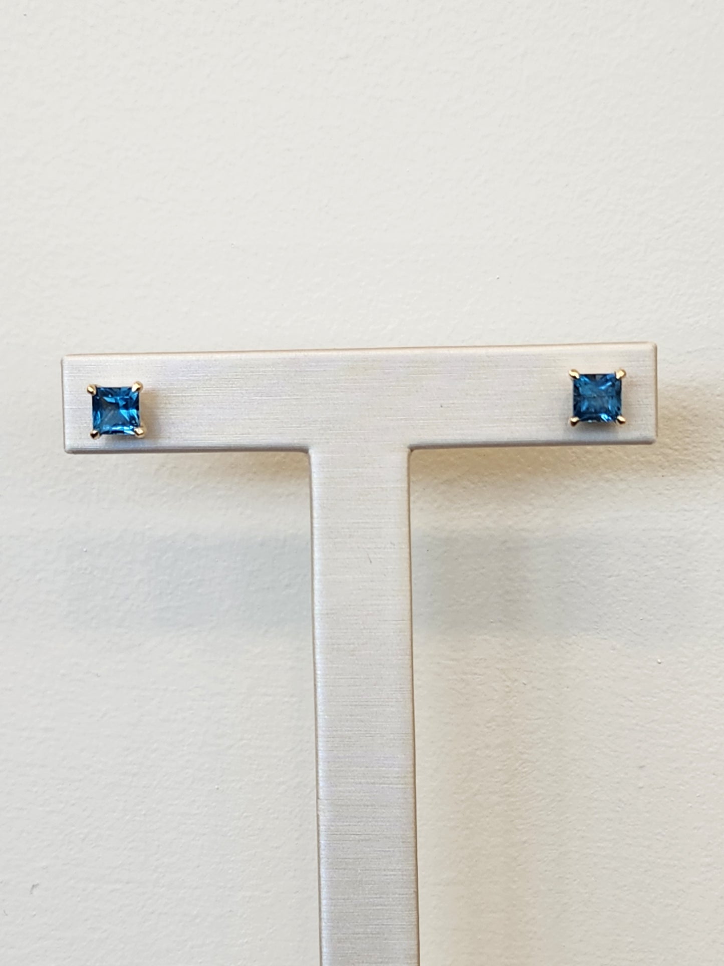14 Karat Yellow Gold Solitaire Square Blue Topaz Stud Earrings