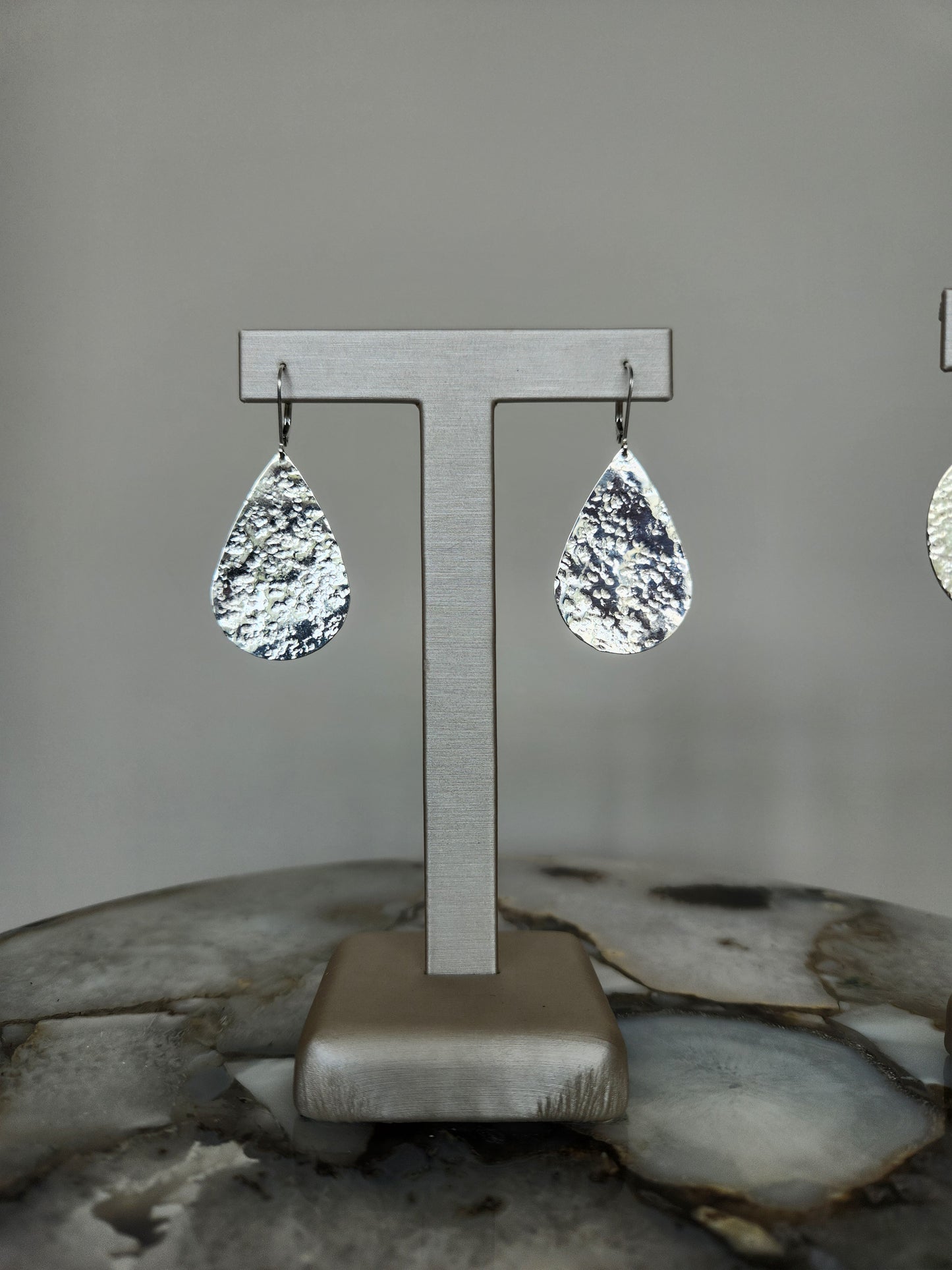 Sterling Silver Pear Shaped Dangle Earrings With Hammered Finish