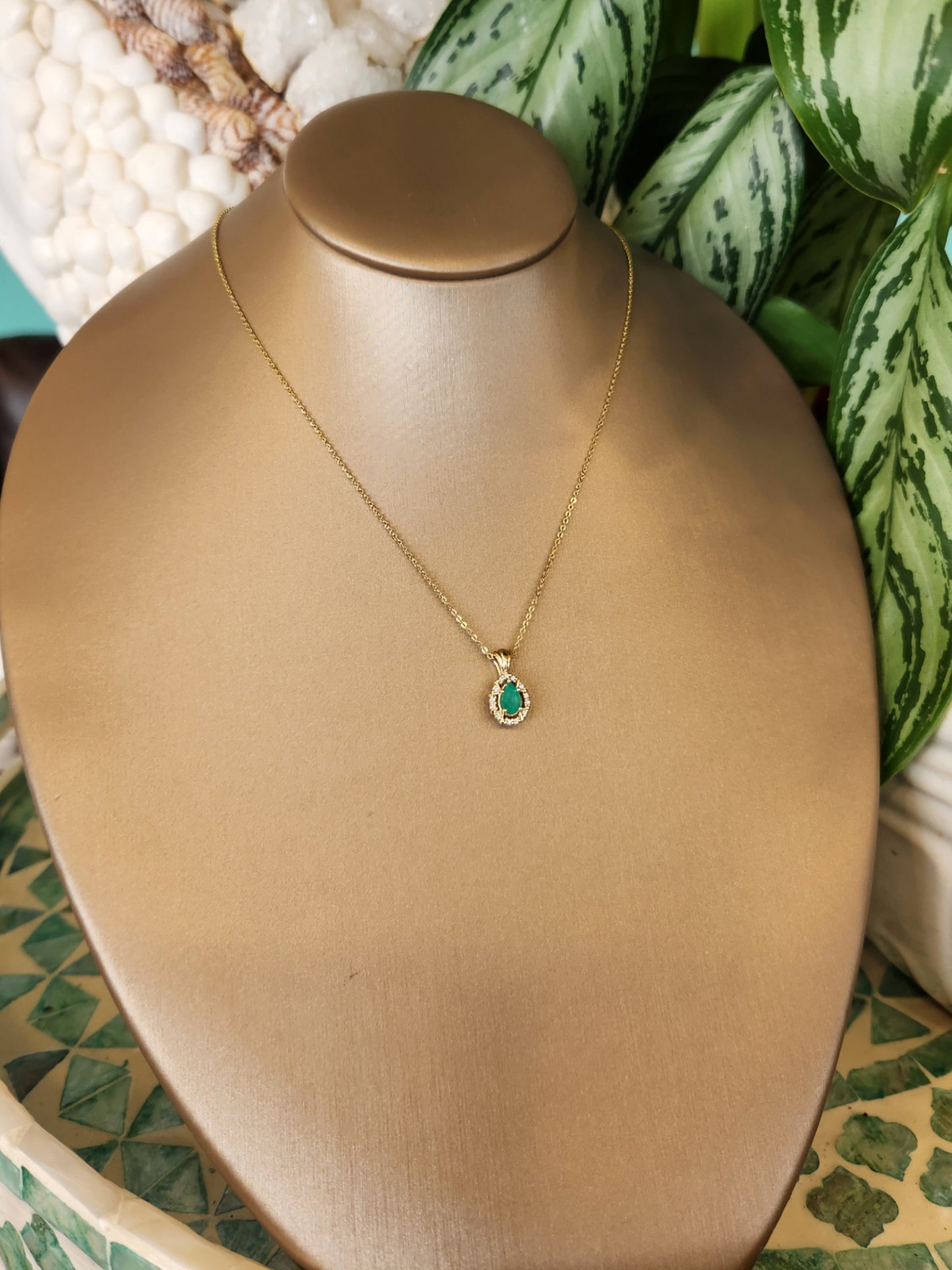 14 Karat Yellow Gold Pear Shaped Emerald Pendant With Diamond Halo