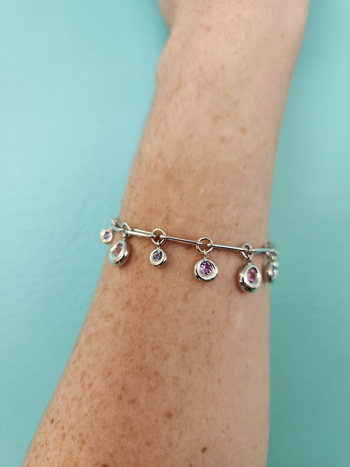 Vintage 18 Karat White Gold Chaumet Round Dangle Bracelet With Pink, Purple & Blue Sapphires, 7.25"