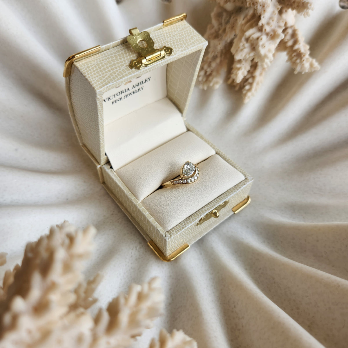 14 Karat Yellow Gold Pear Shaped Diamond "Wave" Design Ring With Channel Set Diamond Accents