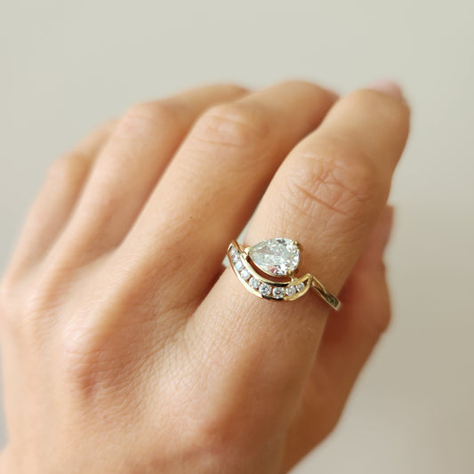 14 Karat Yellow Gold Pear Shaped Diamond "Wave" Design Ring With Channel Set Diamond Accents