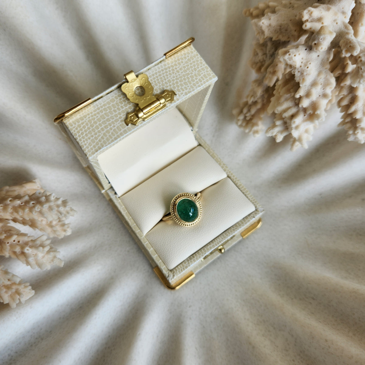14 Karat Yellow Gold Bezel Set Oval Cabochon Emerald Ring With Milgrain Detail