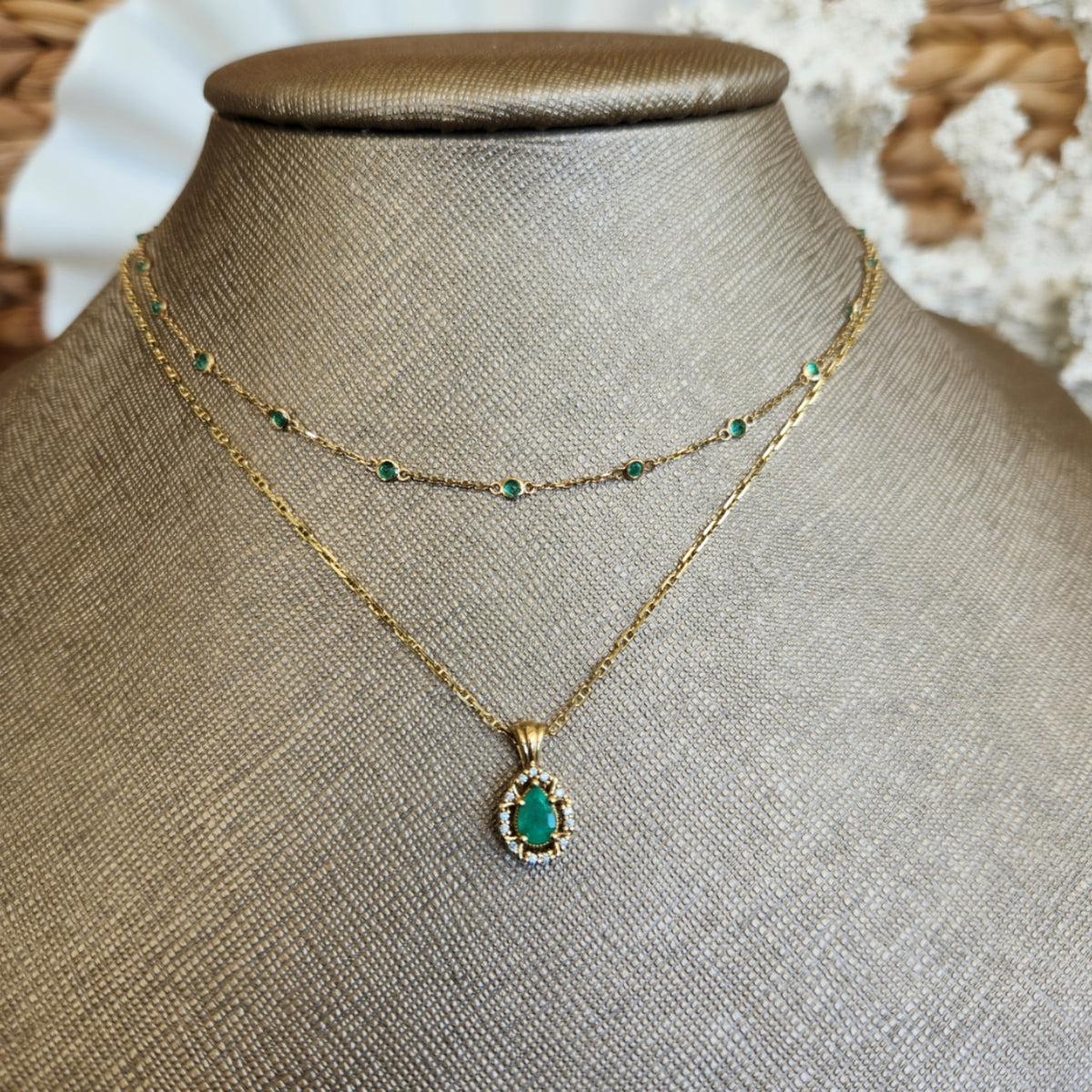 14 Karat Yellow Gold Pear Shaped Emerald Pendant With Diamond Halo