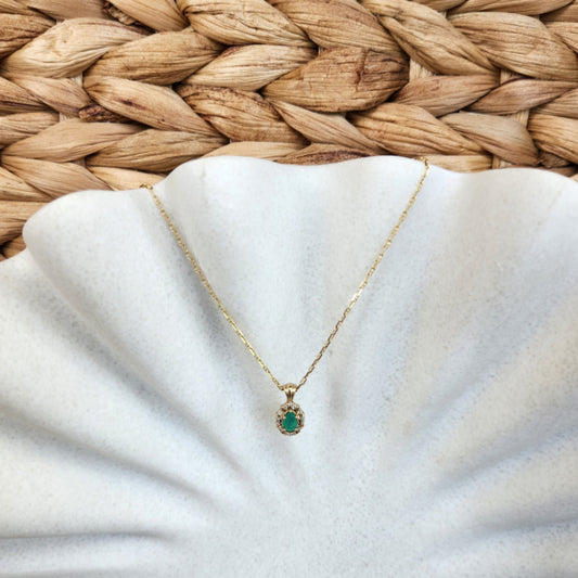 14 Karat Yellow Gold Pear Shaped Emerald Pendant With Diamond Halo
