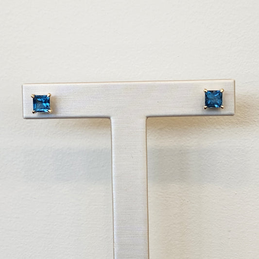 14 Karat Yellow Gold Solitaire Square Blue Topaz Stud Earrings