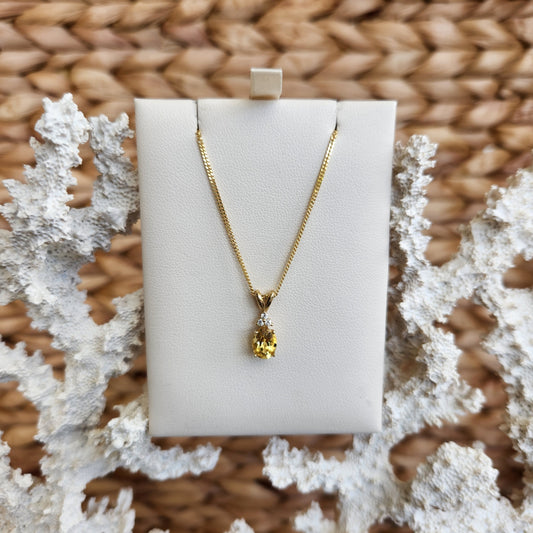 14 Karat Yellow Gold Oval Heliodore Pendant With Diamond Accents
