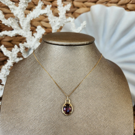 14 Karat Yellow Gold Color Change Garnet Pendant With Diamond Bail