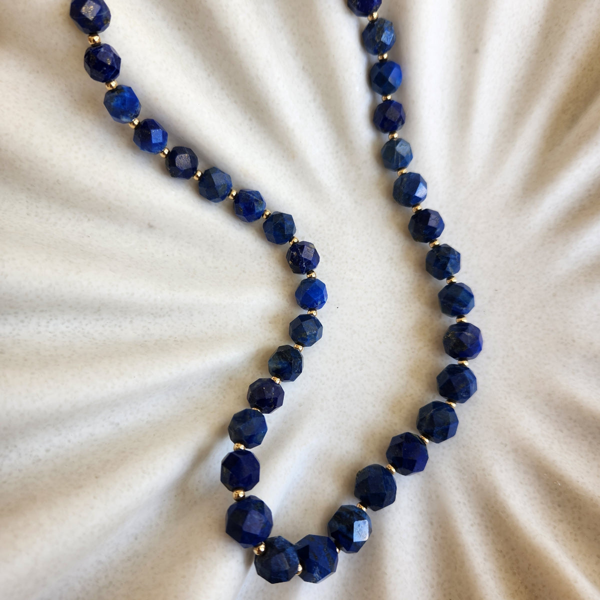 14 Karat Yellow Gold Faceted Lapis Bead Necklace, 22"
47 Beads = 7.5-
