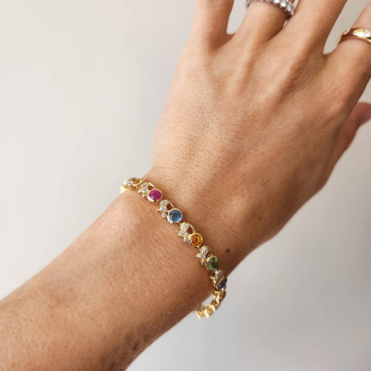 18 karat yellow gold multi-color sapphire bracelet with accent diamonds, 7"