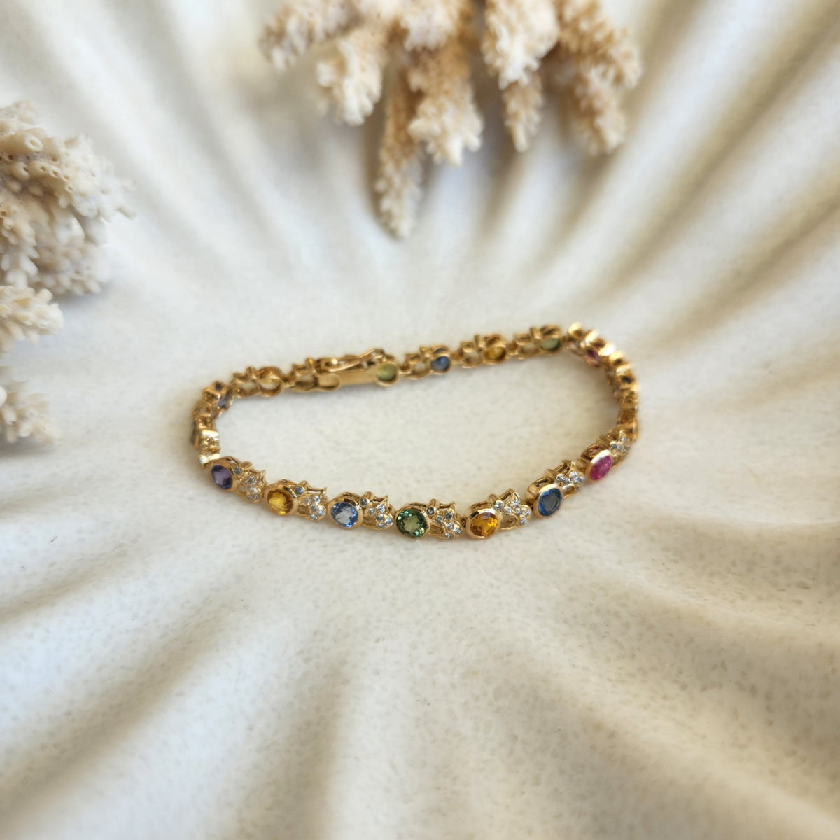 18 karat yellow gold multi-color sapphire bracelet with accent diamonds, 7"