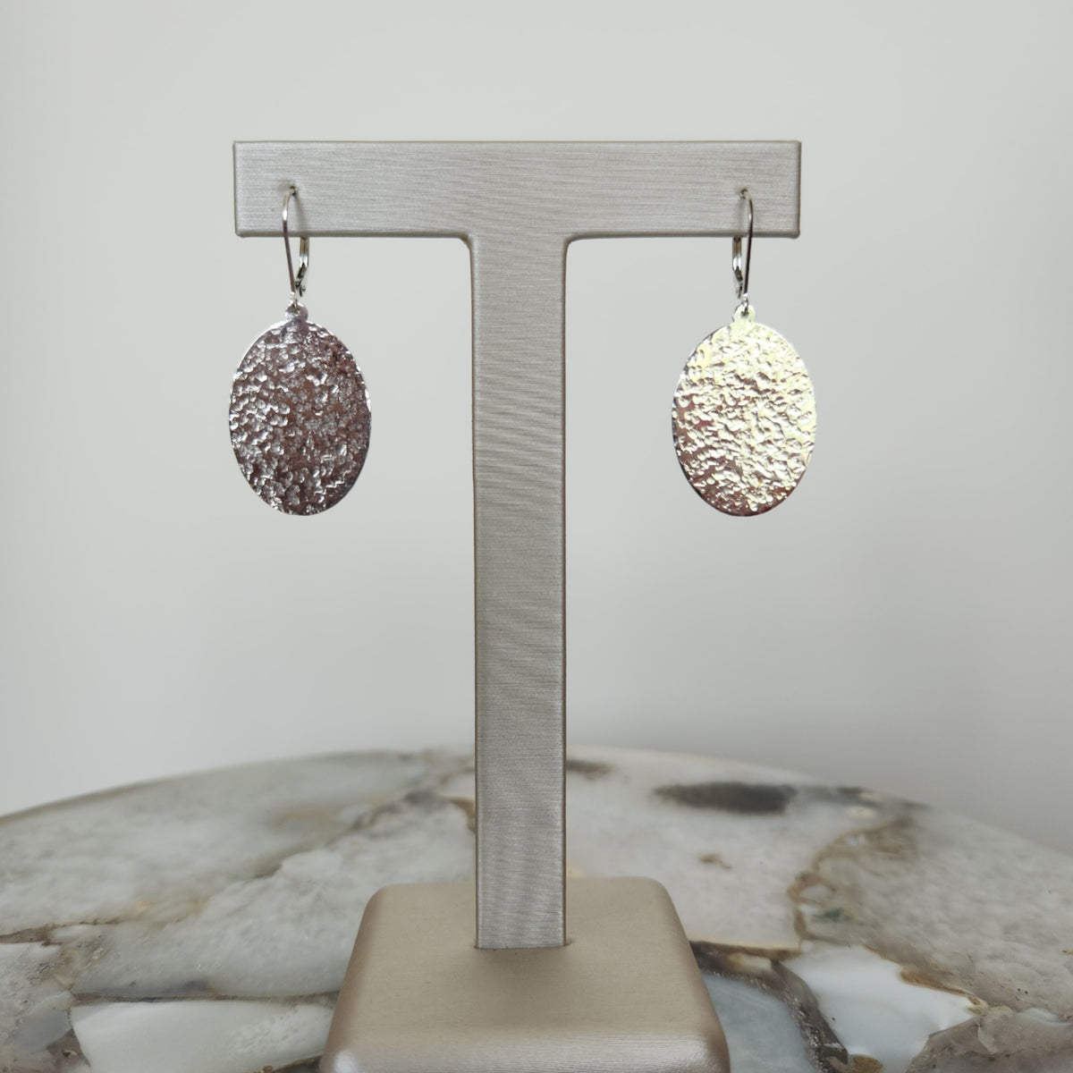 Sterling Silver Oval Dangle Earrings With Hammered Finish