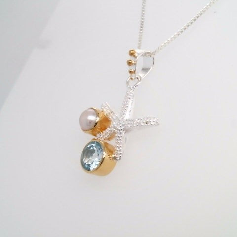 Sterling Silver And 22 Karat Gold Vermeil Starfish Necklace With 1 Round Sky Blue Topaz And 1 White Freshwater Pearl 18" Chain Included