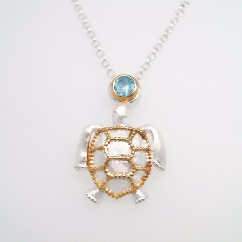 Sterling Silver And 22 Karat Gold Vermeil Sea Turtle Pendant With 1 Round Blue Topaz