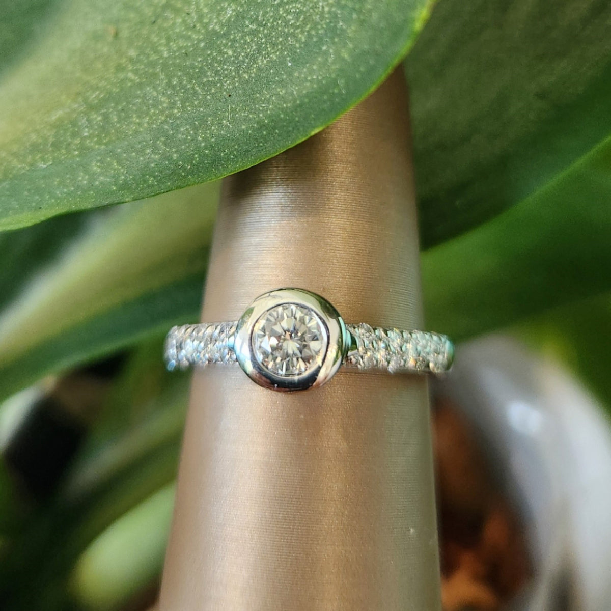 18 Karat White Gold Diamond Engagement Ring With Bezel Set Diamond