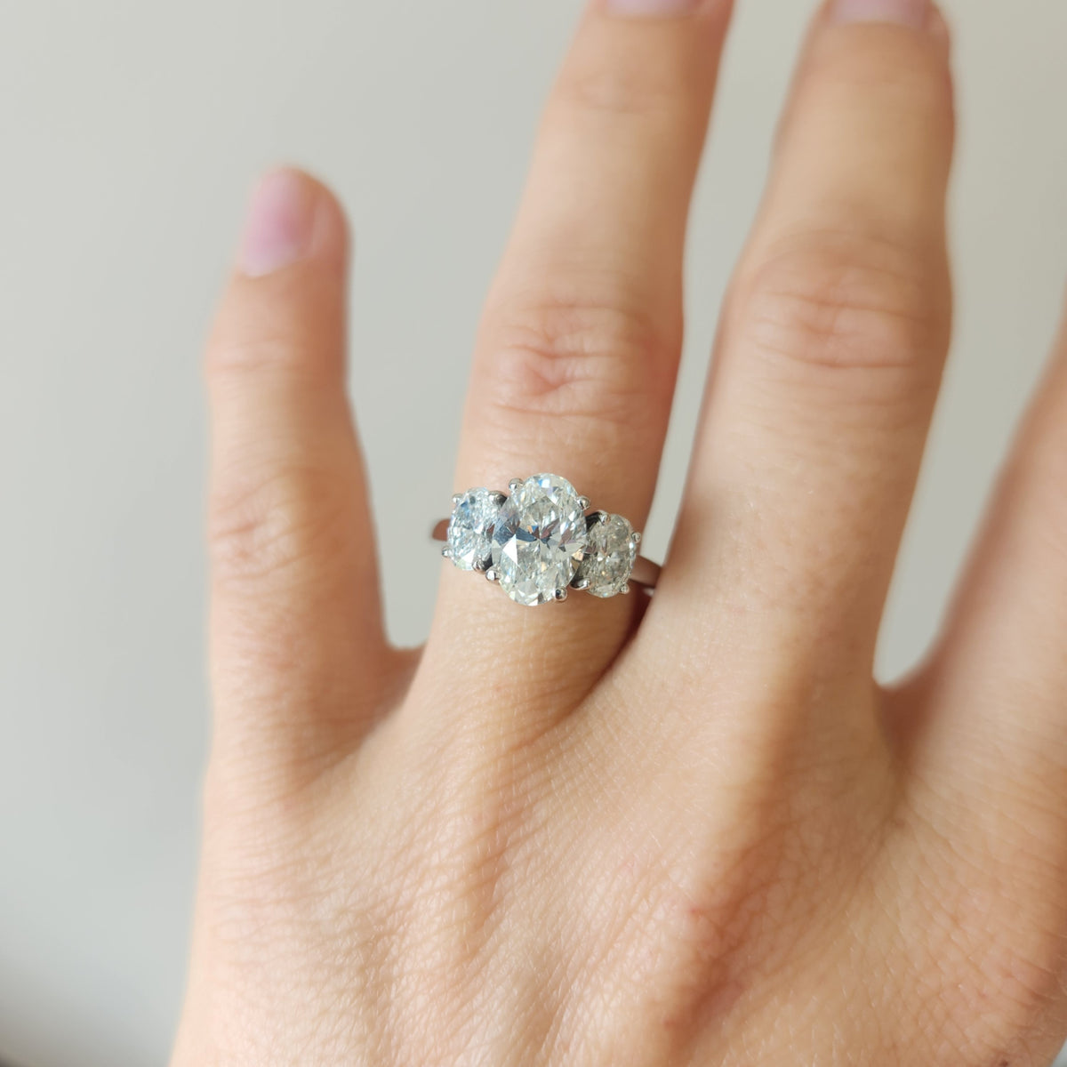 Platinum And Diamond Three Stone Engagement Ring.  
Center Oval 1.71C