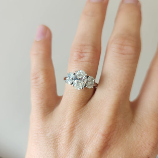 Platinum And Diamond Three Stone Engagement Ring.  
Center Oval 1.71C