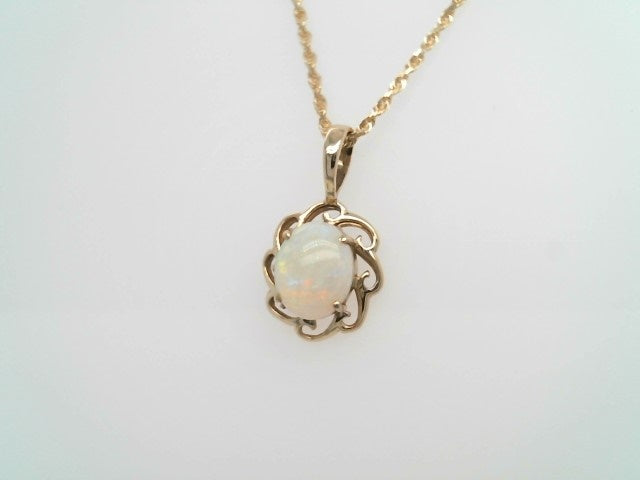 Vintage 14 Karat Yellow Gold Opal Pendant With Wave Design Frame