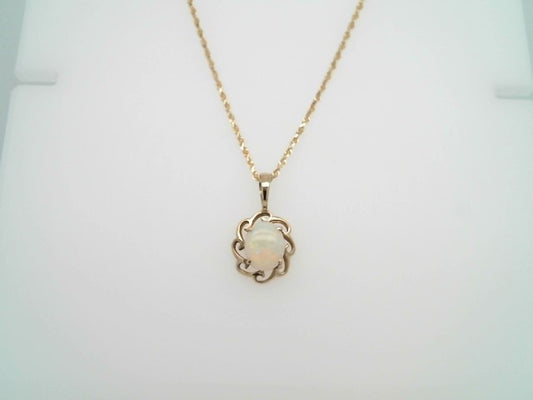 Vintage 14 Karat Yellow Gold Opal Pendant With Wave Design Frame