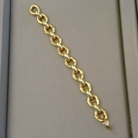 18KYG 7 inch oval fully rounded semi solid links connected by fully rounded half oval links with securing flat back design. Having  fold over clasp with safety figure 8 clasp.