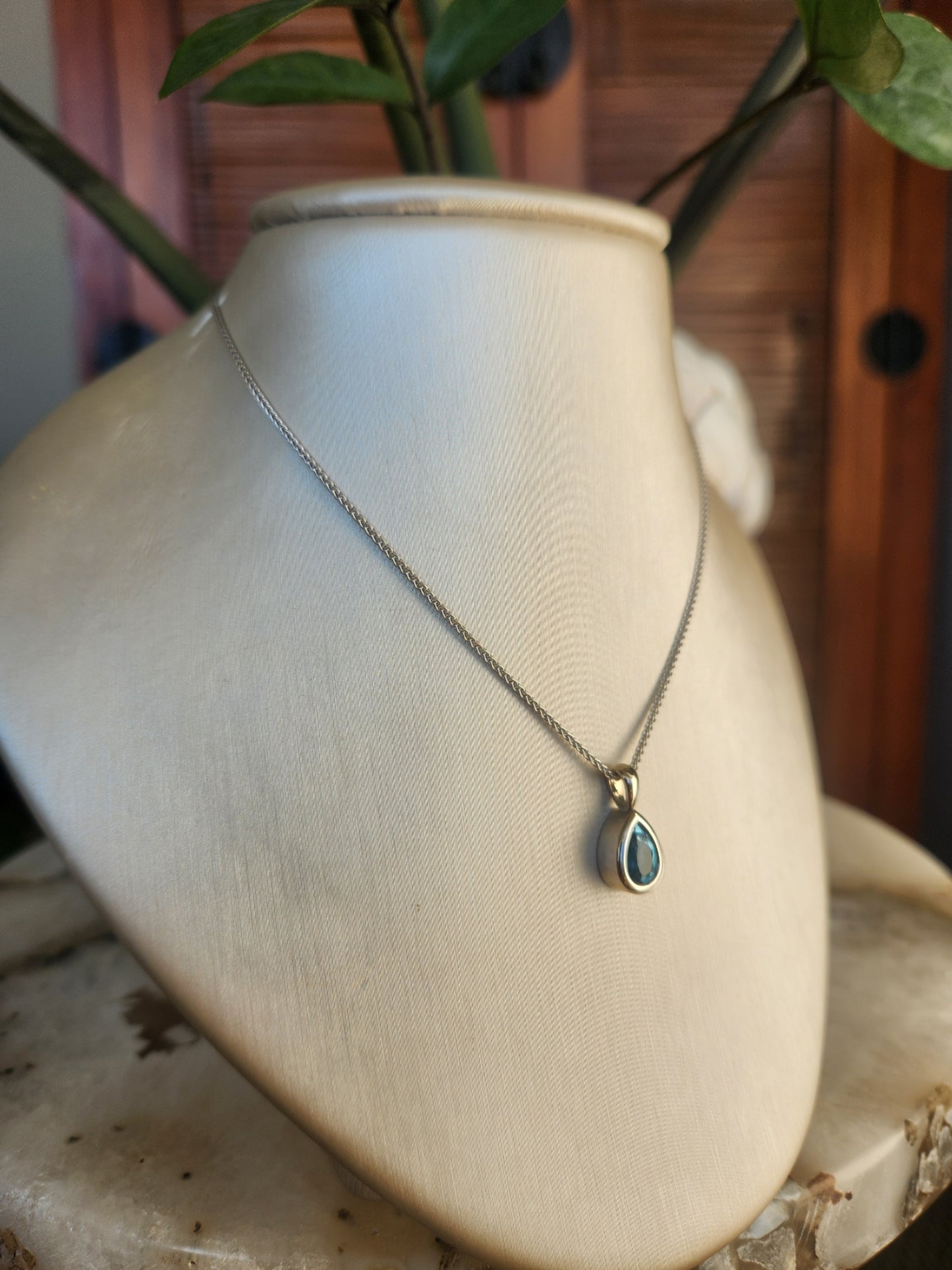 14 Karat White Gold Bezel Set Pear Blue Topaz Solitaire Pendant