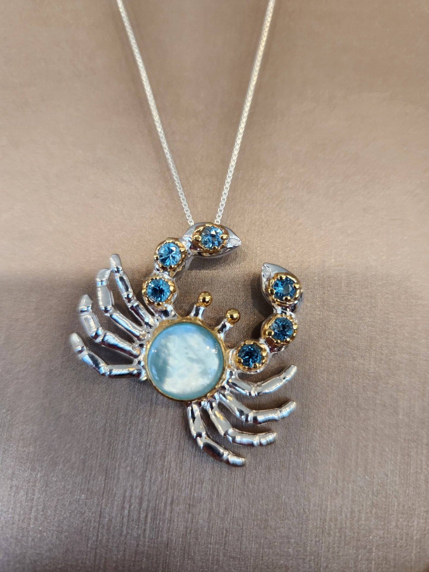 Sterling Silver And 22 Karat Gold Vermeil Crab Pendant with Mother of Pearl, Amazonite, and Blue Topaz