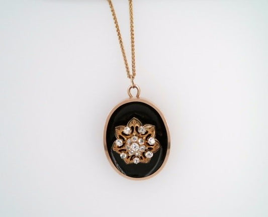 Antique Victorian Era 14 Karat Yellow Gold Oval Pendant/Pin With Black Onyx & Old Mine Cut Diamond Floral Cluster In Center With Black Enamel Accents