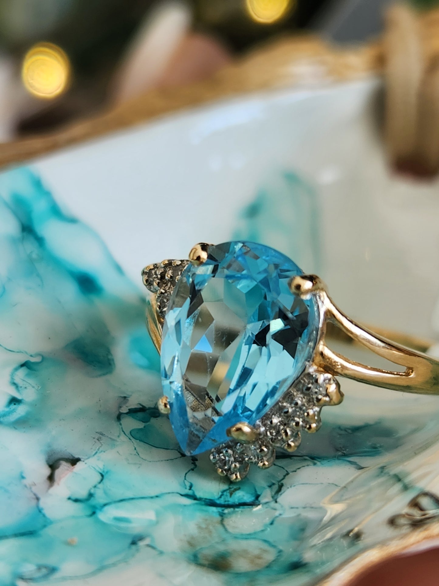 Vintage 14 Karat Yellow Gold Pear Shaped Blue Topaz Bypass Style Ring With Diamond Accents