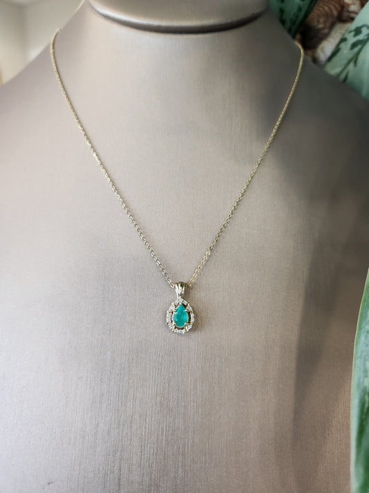 14 Karat Yellow Gold Pear Shaped Emerald Pendant With Diamond Halo