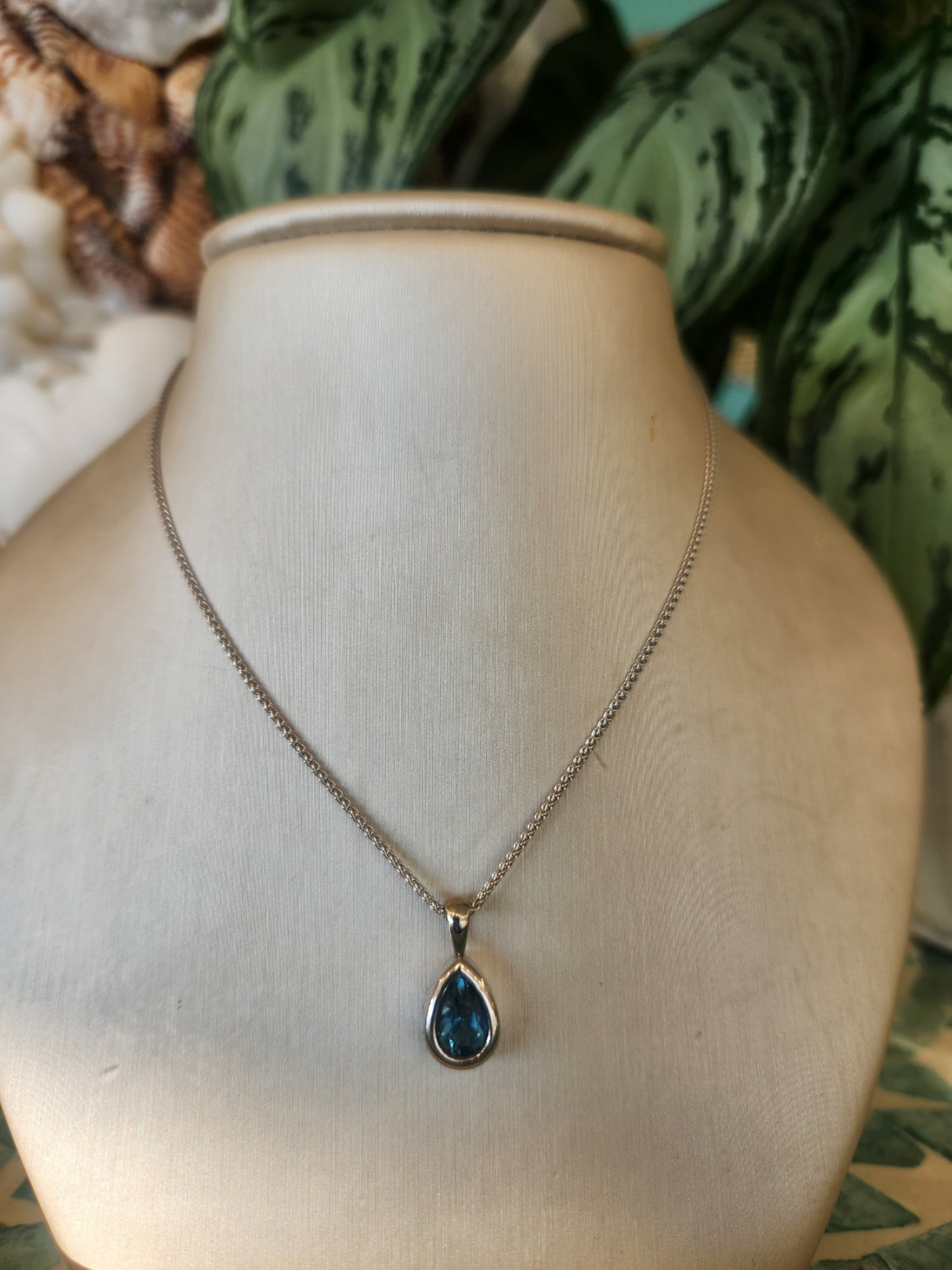 14 Karat White Gold Bezel Set Pear Blue Topaz Solitaire Pendant