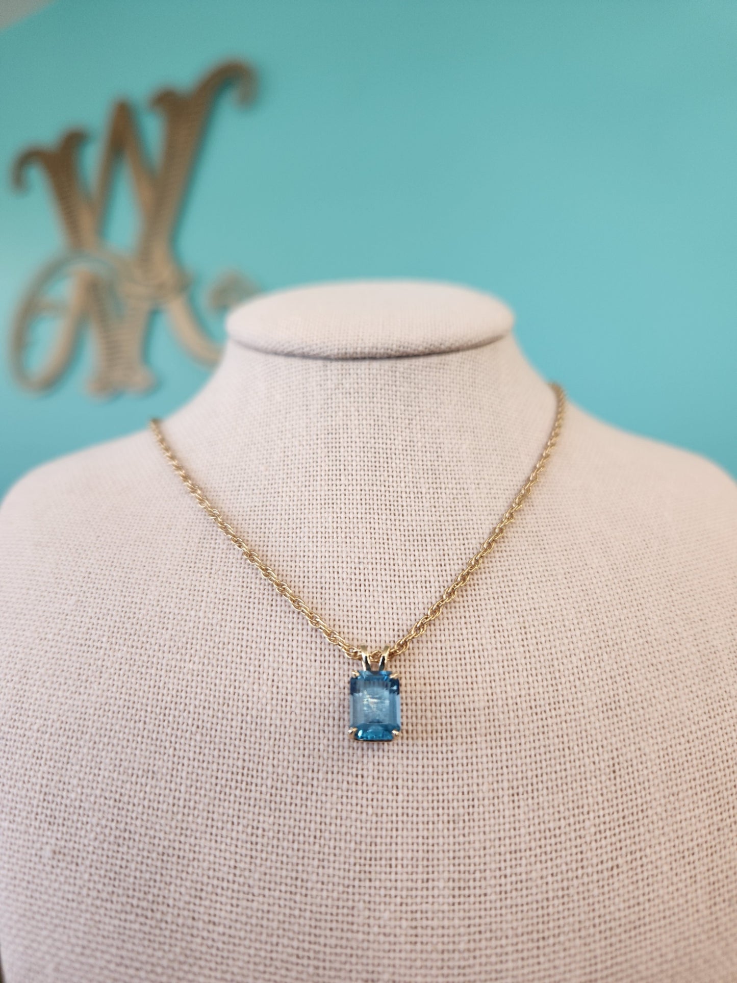 14 Karat Yellow Gold Emerald Cut Blue Topaz Solitaire Pendant