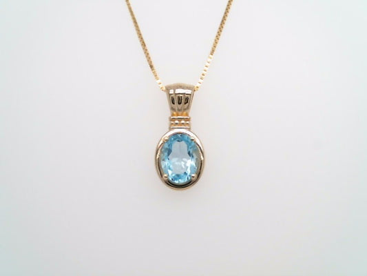 14 Karat Yellow Gold Blue Topaz Pendant With Beaded Detail