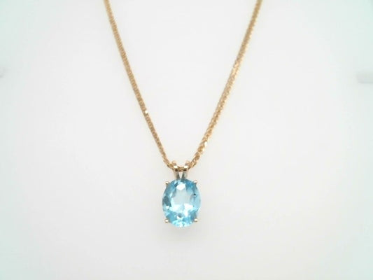 14 Karat Yellow Gold Oval Blue Topaz 4 Prong Set Solitaire Pendant