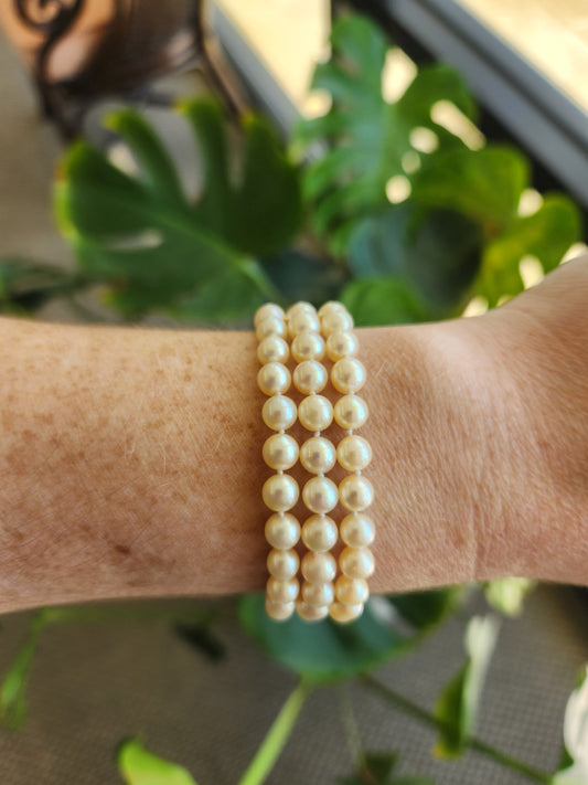 14 Karat Yellow Gold Triple Strand Akoya Cultured Pearl Bracelet, 7"