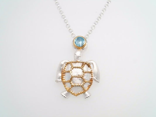 Sterling Silver And 22 Karat Gold Vermeil Sea Turtle Pendant With 1 Round Blue Topaz