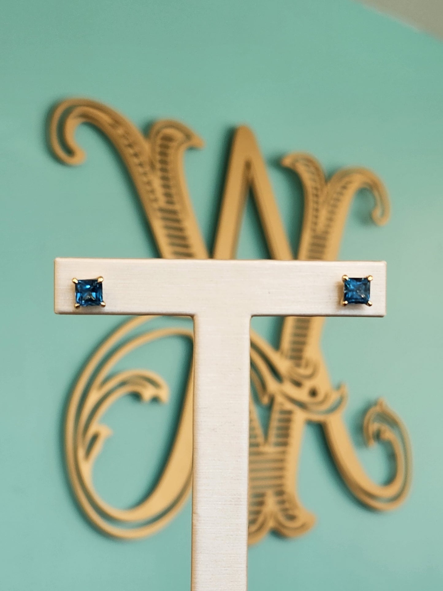 14 Karat Yellow Gold Solitaire Square Blue Topaz Stud Earrings