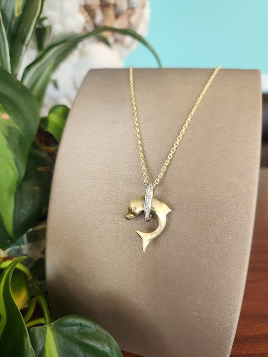 Vintage 14 Karat Yellow Gold Dolphin Jumping Thorugh A Diamond Hoop Pendant With Brushed Finish